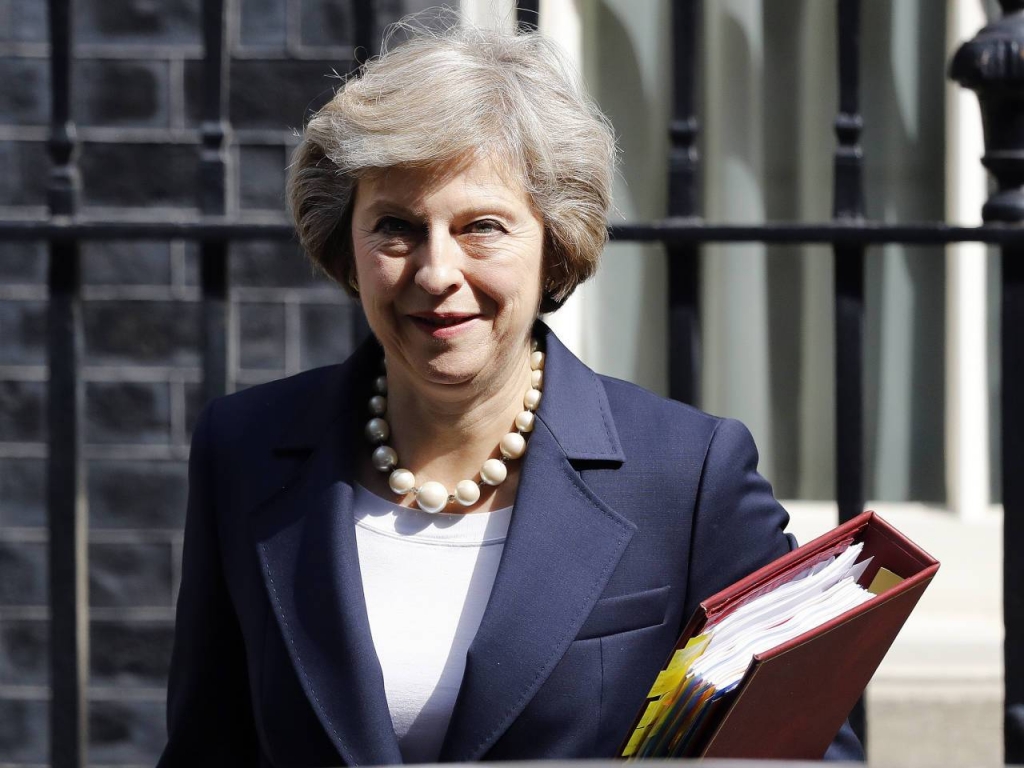 Britain's Prime Minister Theresa May leaves 10 Downing street for Prime Ministers Questions at the House of Parliament in London. On her first visit to China as Britain’s prime minister Theresa May will try to