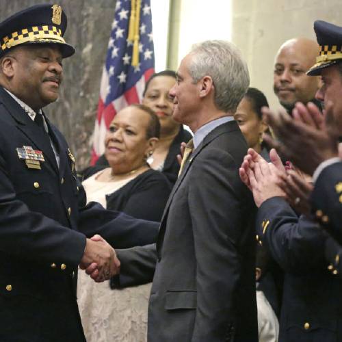 Chicago Mayor Rahm Emanuel shakes hands with Eddie Johnson after swearing him in as the new Chicago police superintendent in Chicago. Emanuel will deliver his public safety plan for the nation's third