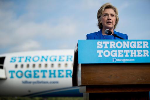 Democratic presidential candidate Hillary Clinton speaks to members of the media before boarding her campaign plane at Westchester County Airport in White Plains N.Y. Thursday Sept. 8 2016 to travel to Charlotte N.C. to attend a campaign rally. (AP