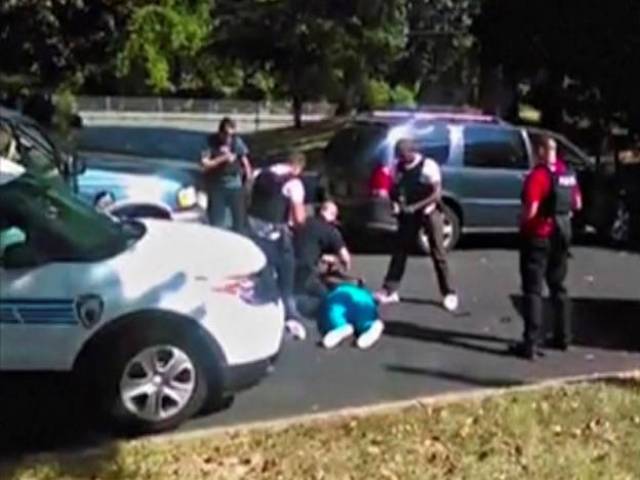 Keith Scott lies on the ground after being fatally shot by police in Charlotte North Carolina US in this still image taken from video received by Reuters