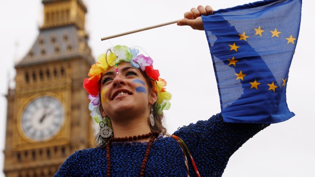 A Pro Europe demonstrator in London on Saturday waves a flag during a March for Europe protest against the Brexit vote result earlier in the year