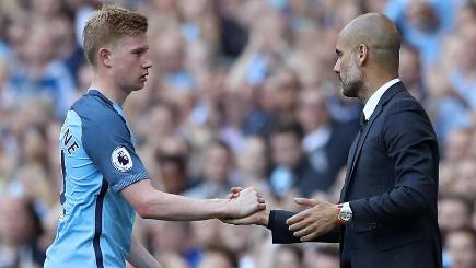 Kevin De Bruyne left is congratulated by his manager Pep Guardiola