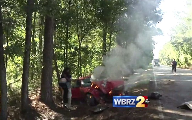 Dramatic rescue Cameraman Patrick Perry picked the woman up out of the car and carried her away from the burning vehicle