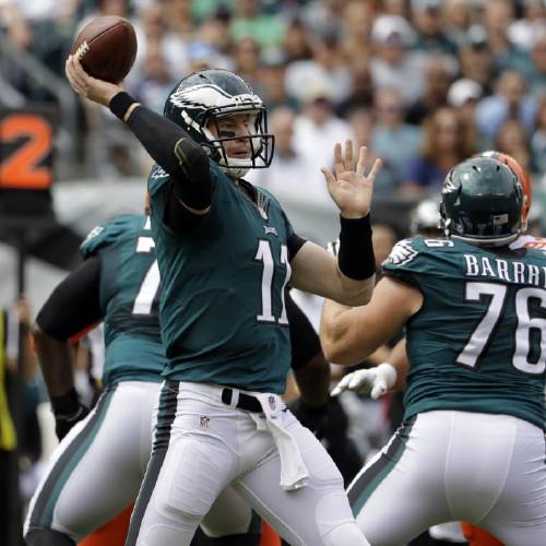 In this Sunday Sept. 11 2016 Philadelphia Eagles quarterback Carson Wentz throws a pass during the first half of an NFL football game against the Cleveland Browns in Philadelphia. Wentz looks to build on a promising start to his career