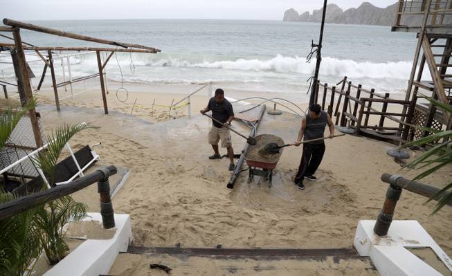 Eduardo Verdugo  AP Two men shovel sand deposited by Hurricane Newton from inside a restaurant in Cabo San Lucas Mexico Tuesday Sept. 6 2016