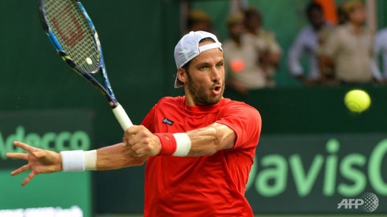 Feliciano Lopez of Spain in Davis Cup action against India's Ramkumar Ramanathan in New Delhi on Sep 16 2016