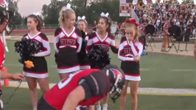 Foothill High School football players place roses at feet of Ashley Adamietz