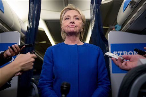 Democratic presidential candidate Hillary Clinton pauses while she gives remarks on the explosion in Manhattan's Chelsea neighborhood onboard her campaign plane at Westchester County Airport in White Plains N.Y. Saturday Sept. 17 2016. (AP