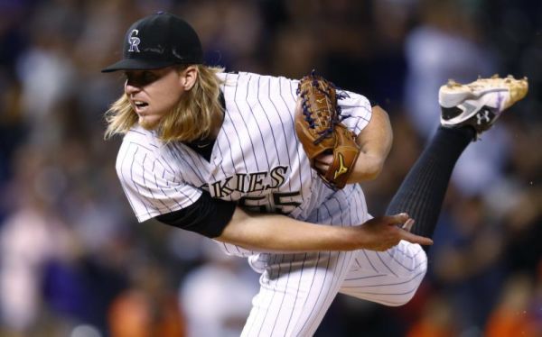 Colorado Rockies starting pitcher Jon Gray delivers