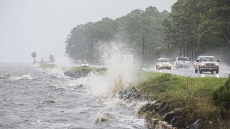 Traffic moves along U.S. Highway 98 in Eastpoint Fla. ahead of Hermine which made landfall early Friday