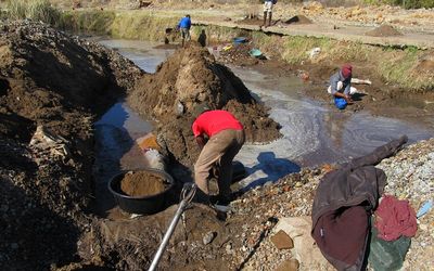 Illegal miners work on a disused mine in Welkom Free State