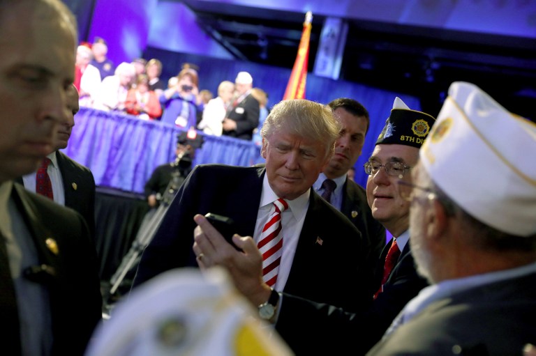 Republican presidential candidate Donald Trump greets people at the American Legion Convention in Cincinnati Ohio