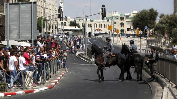 Israeli police officers on horseback stand guard near the scene of an attack at the Damascus gate in Jerusalem's Old City on Friday