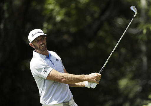 Dustin Johnson tees off on the second hole during the first round of the Tour Championship golf tournament at East Lake Golf Club in Atlanta Thursday Sept. 22 2016