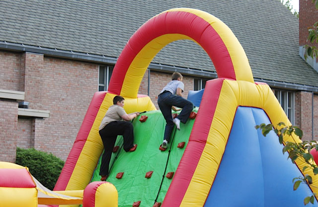 Kids enjoyed a climbable slide at last year's St. Francis Carnival