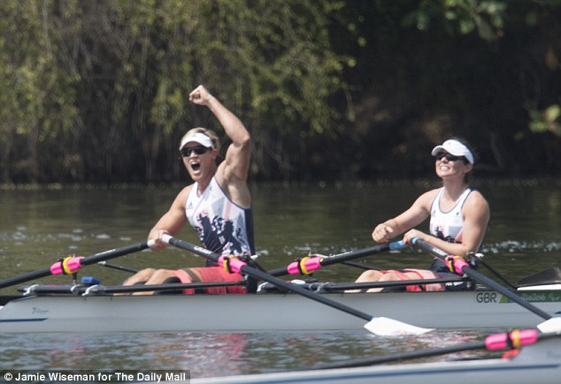 Lauren Rowles and Laurence Whiteley celebrate winning trunk and arm mixed double sculls