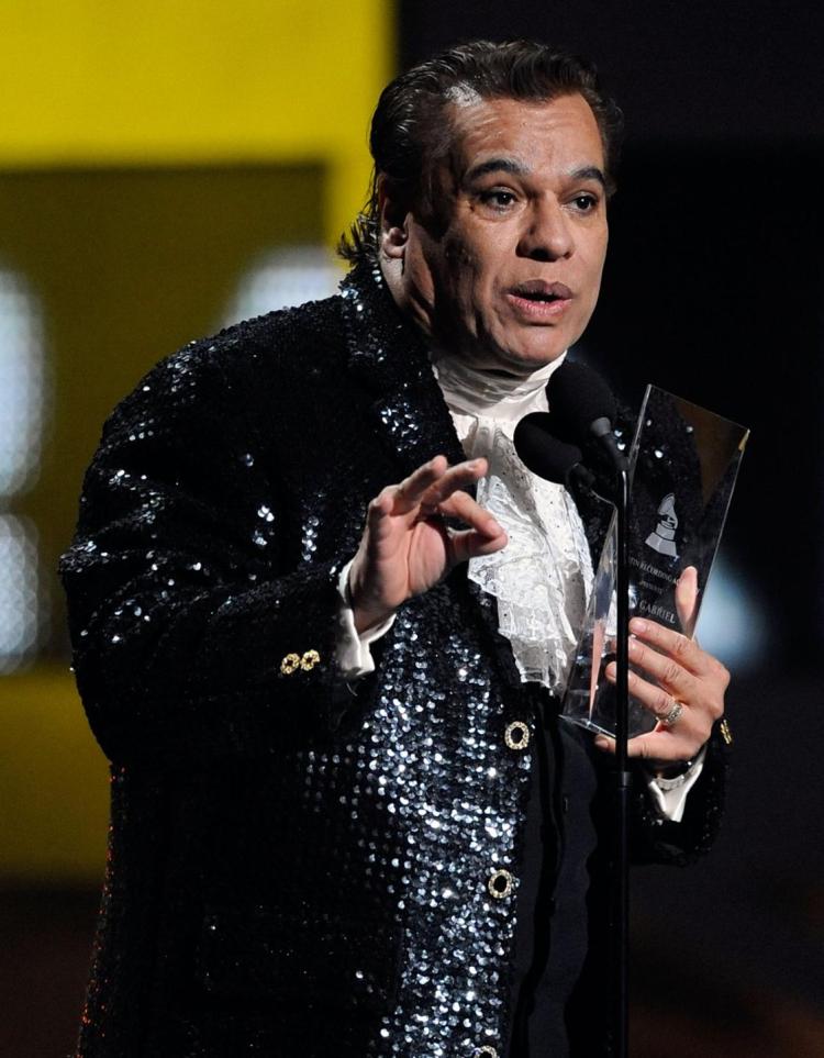 Singer Juan Gabriel accepts the Person of the Year award onstage during the 10th annual Latin Grammy Awards. Gabriel was Mexico's leading singer-songwriter and top-selling artist