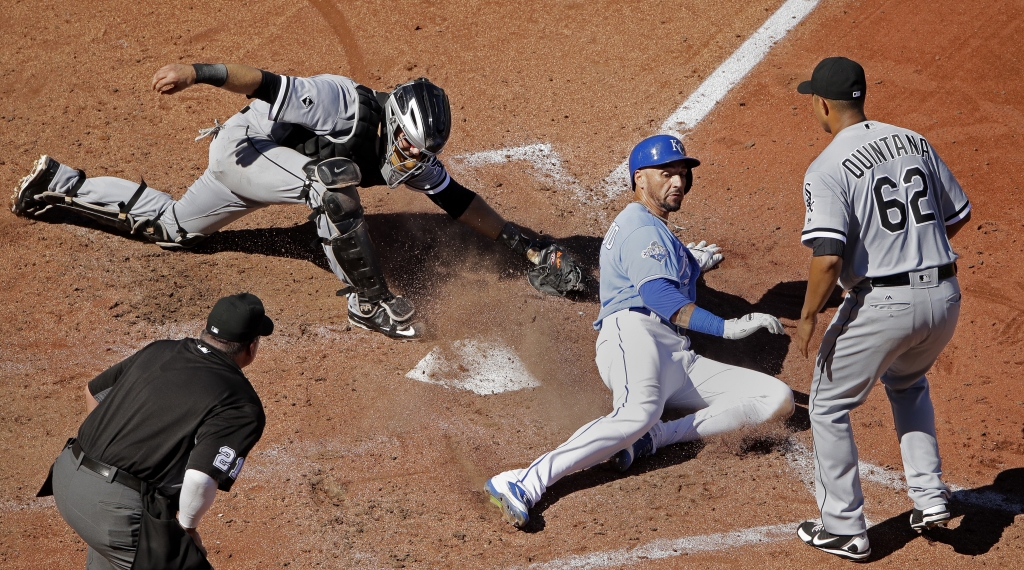 Kansas City Royals&#039 Paulo Orlando beats the tag at home by Chicago White Sox catcher Alex Avila to score on single by Eric Hosmer during the fourth inning of a baseball game Sunday Sept. 18 2016 in Kansas City Mo