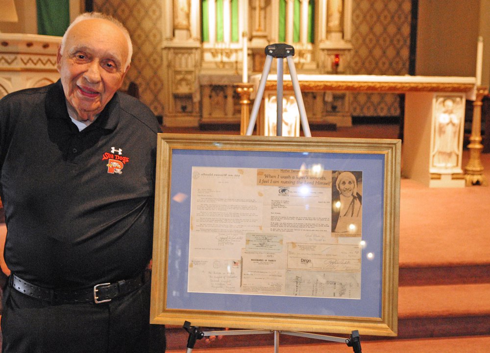 Ralph Ardito Sr. stands with a framed thank-you letter from Mother Teresa on Friday at St. Mary's Church in Augusta. The soon-to-be saint wrote in 1978 to thank a local Knights of Columbus group for a $1,000 donation