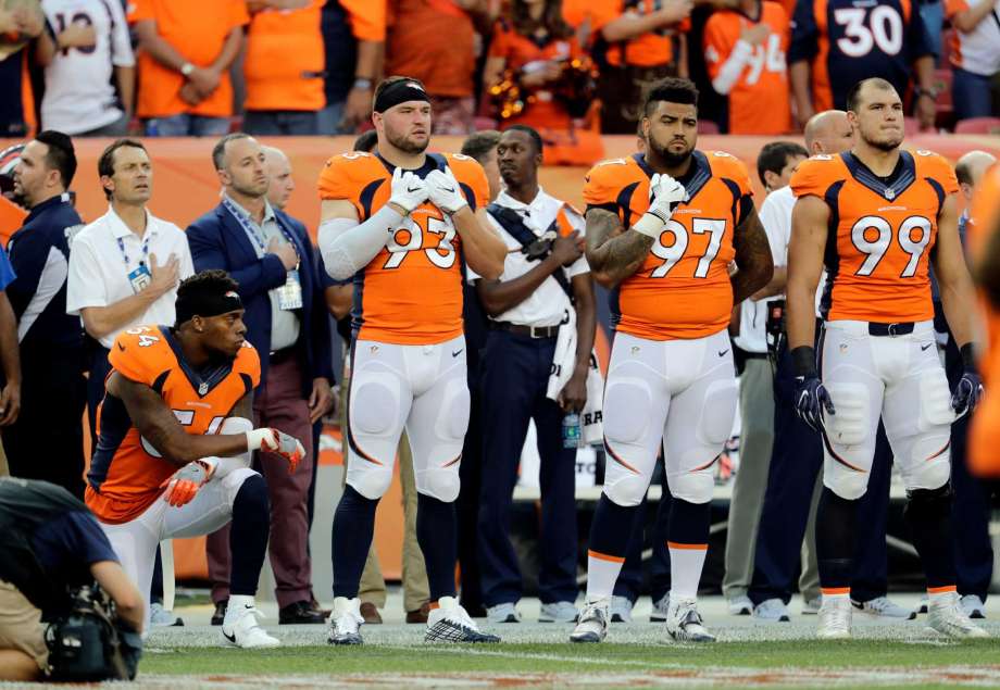 Denver Broncos inside linebacker Brandon Marshall kneels during the National Anthem prior to an NFL football game against the Carolina Panthers Thursday Sept. 8 2016 in Denver