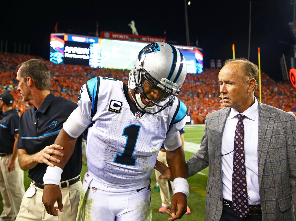 Sep 8 2016 Denver CO USA Carolina Panthers quarterback Cam Newton reacts in pain on the sidelines after suffering an injury in the third quarter against the Denver Broncos at Sports Authority Field at Mile High. Mandatory Credit Mark J. Rebilas