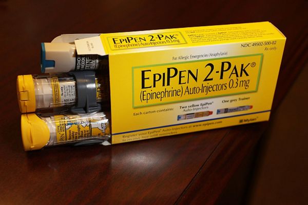 EpiPen which dispenses epinephrine through an injection mechanism