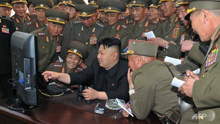 North Korea's leader Kim Jong Un looking at a computer at a military base.
   
 

  Enlarge  Caption