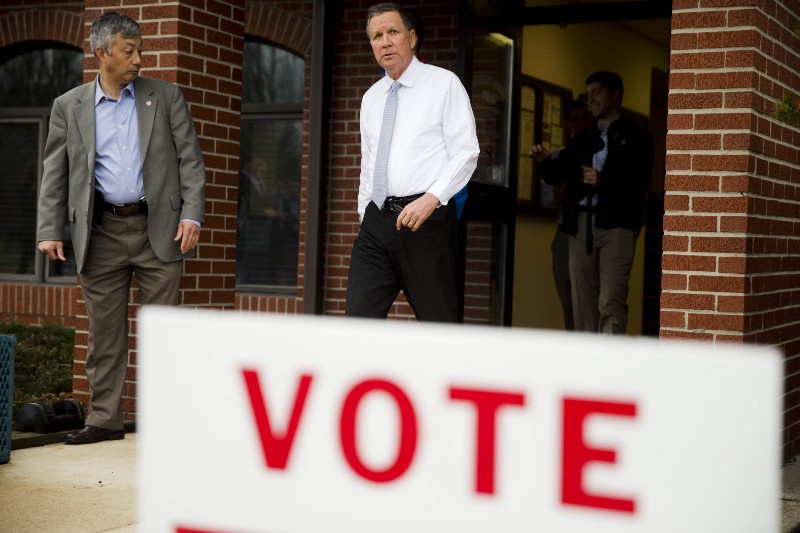 Ohio Gov. John Kasich walks out of a polling station in Westerville Ohio. CREDIT AP