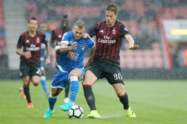 Jack Wilshere takes on Mario Paselic