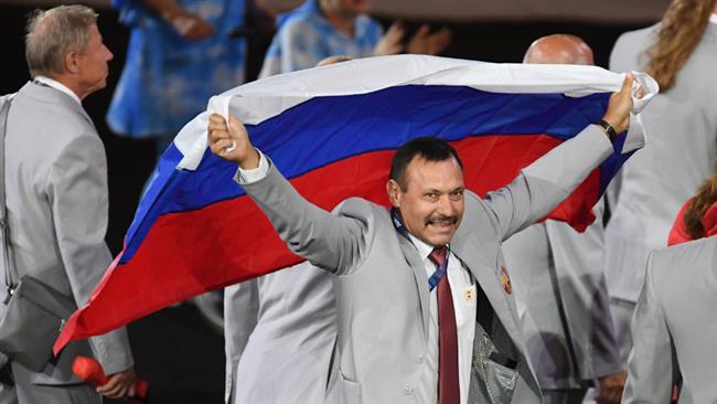 Russian media shows Andrei Fomochkin identified as the director of the republican centre of Olympic training for athletics in Belarus carrying the Russian tricolor in the opening ceremony of the Paralympic