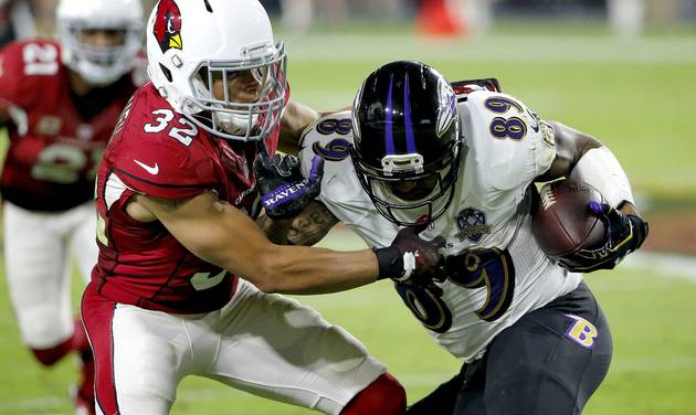 Baltimore Ravens wide receiver Steve Smith is stopped by Arizona Cardinals free safety Tyrann Mathieu during the second half of an NFL football game in Glendale Ariz. This is a team that knows it’s