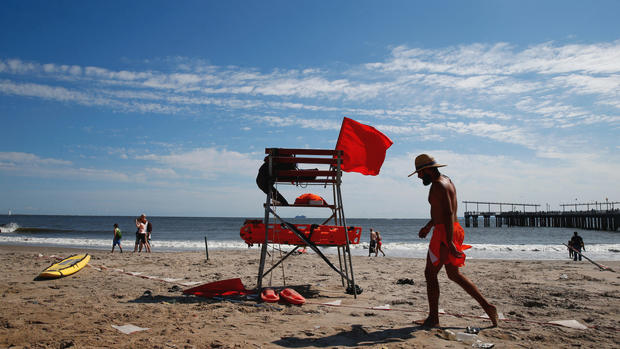 People are seen at Coney Island Sunday in the Brooklyn section of New York. REUTERS  Eric Thayer