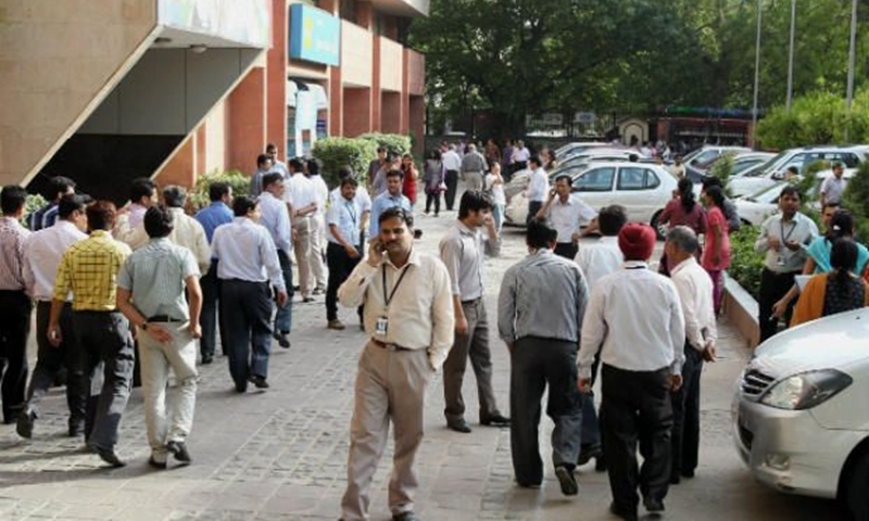 People come out after mild tremors were felt in New Delhi