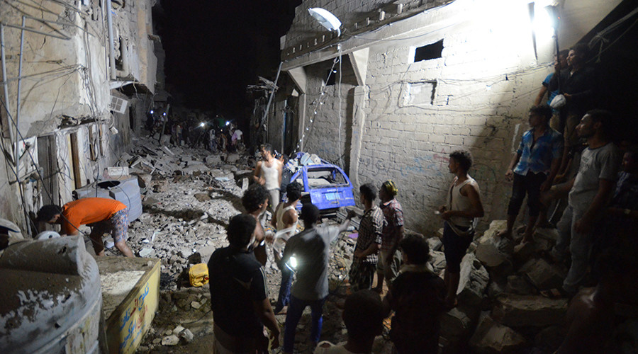 People gather at the site of a Saudi-led air strike in the Red Sea port city of Hodeidah Yemen