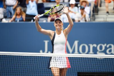 Caroline Wozniacki cruised past American Madison Keys in straight sets on Sunday to reach the U.S. Open quarterfinals