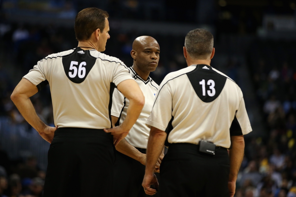 DENVER CO- APRIL 5 Referees Mark Ayotte #56 Tre Maddox #73 and referee Monty Mc Cutchen #13 confer during a break in the action between the Oklahoma City Thunder and the Denver Nuggets at Pepsi Center