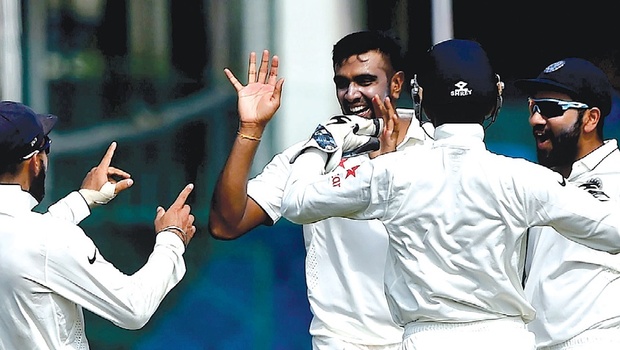 R Ashwin celebrates with teammates after removing Kane Williamson