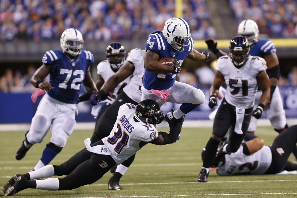 05 Oct 2014 Indianapolis Colts running back Ahmad Bradshaw tries to jump over Baltimore Ravens safety Terrence Brooks during the football game between the Baltimore Ravens vs Indianapolis Colts at Lucas Oil Stadium in Indianapolis IN