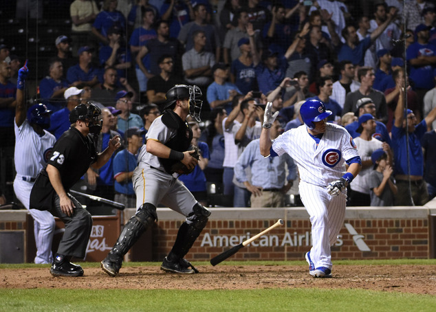 Chicago Cubs Miguel Montero hits a game-ending RBI single against the Pittsburgh Pirates during the thirteenth inning of a baseball game Monday Aug