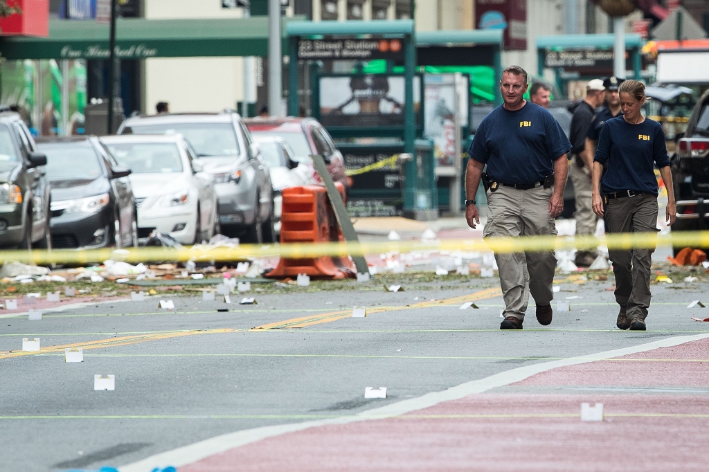 Two members of the FBI work at the scene of an explosion in the Chelsea neighborhood of Manhattan Sept. 18 2016 in New York City