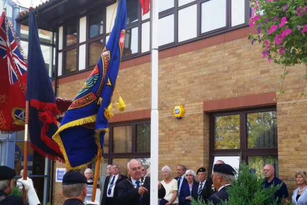 Red Ensign raised at council offices to honour the Merchant Navy and the sacrifices made in wartime. ANL-160209-192146001