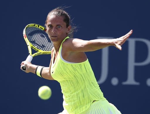 Roberta Vinci of Italy returns a shot to Lesia Tsurenko of Ukraine during the fourth round of the U.S. Open tennis tournament Sunday Sept. 4 2016 in New York