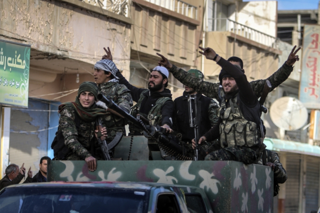 ReutersFighters of the Kurdish People's Protection Unit in the Syrian Kurdish city of Qamishli