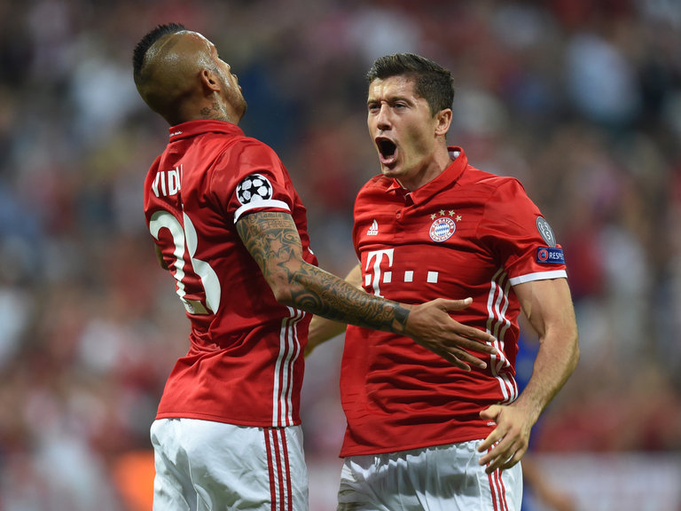 Bayern Munich's Robert Lewandowski and his Arturo Vidal celebrate victory against Rostov