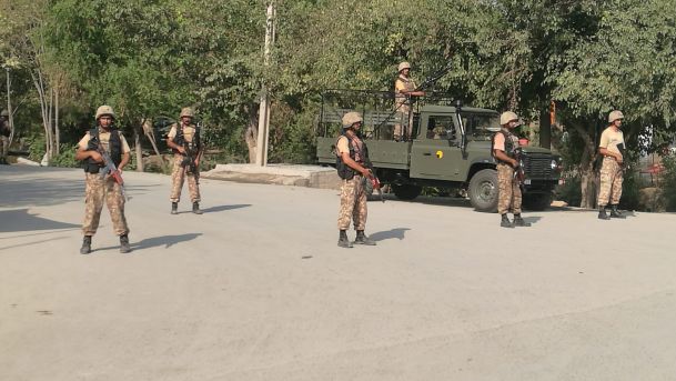 Soldiers on guard at the scene of suicide bomber attack near Peshawar Pakistan