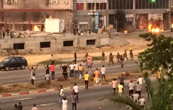 Soldiers patrol a street near opposition campaign headquarters in Libreville