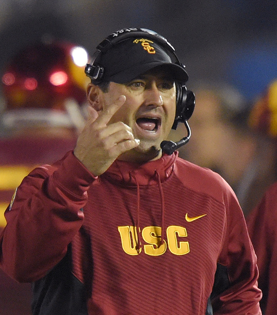 Southern California head coach Steve Sarkisian gestures during the first half of an NCAA college football game against UCLA in Pasadena Calif