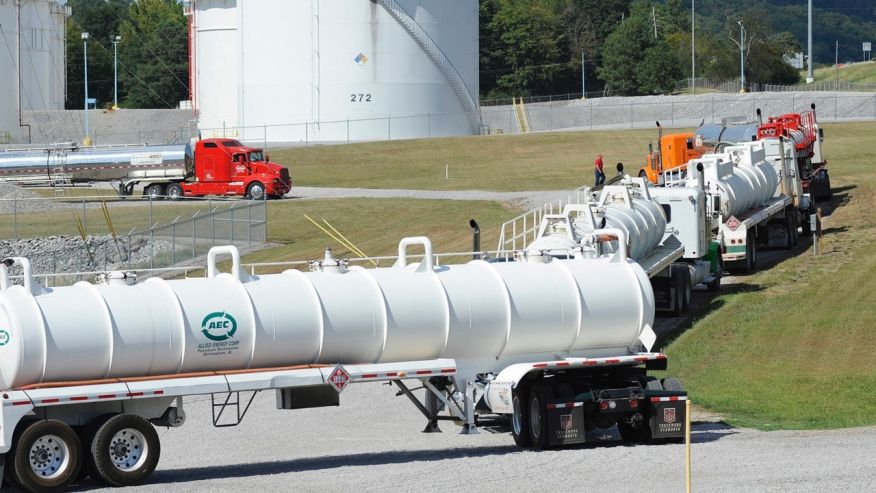 Tanker trucks line up at a Colonial Pipeline Co. facility in Pelham Ala. near the scene of the 250,000-gallon spill