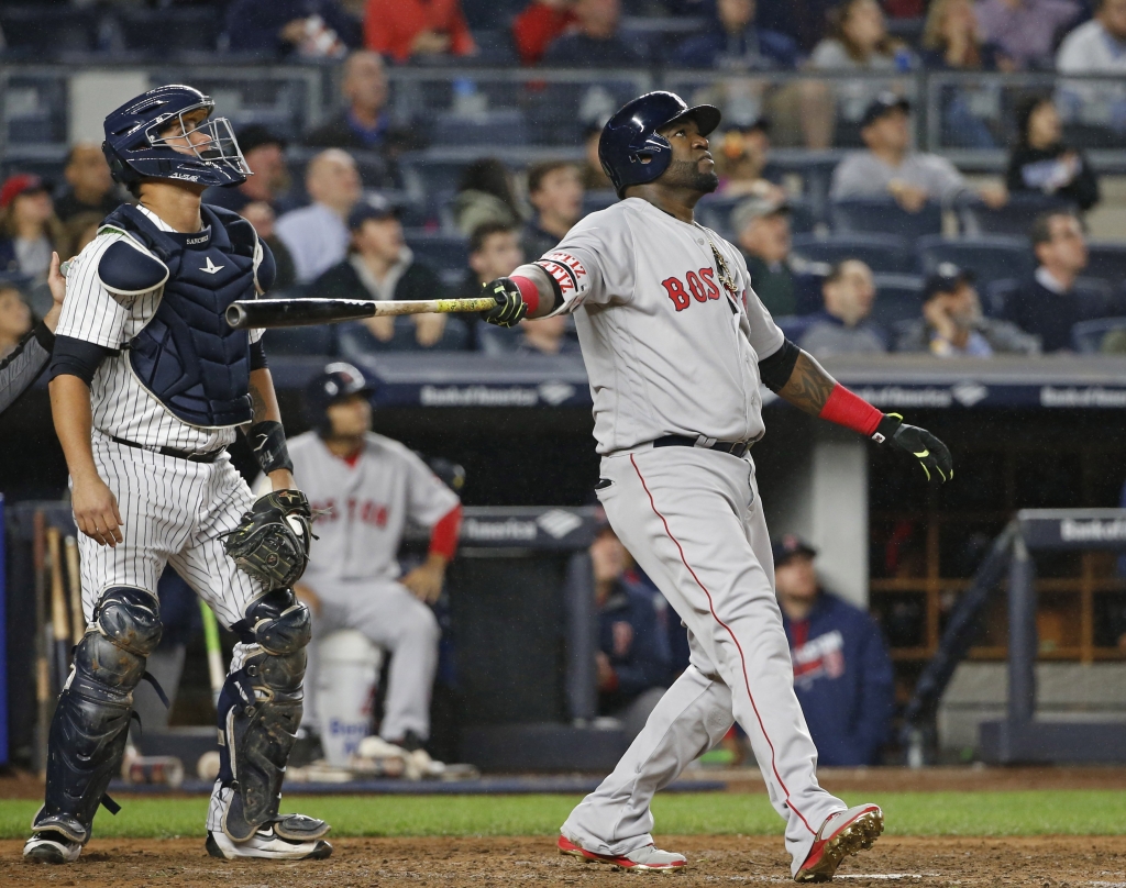 Boston Red Sox designated hitter David Ortiz watches his sixth-inning flyout to deep center field in a baseball game against the New York Yankees in New York Wednesday Sept. 28 2016. New York Yankees catcher Gary Sanchez left watches along with