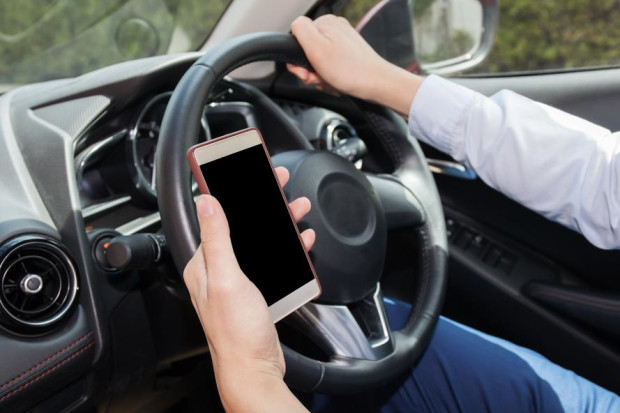 The RAC is calling for an awareness campaign to highlight the dangers of using mobile phones at the wheel